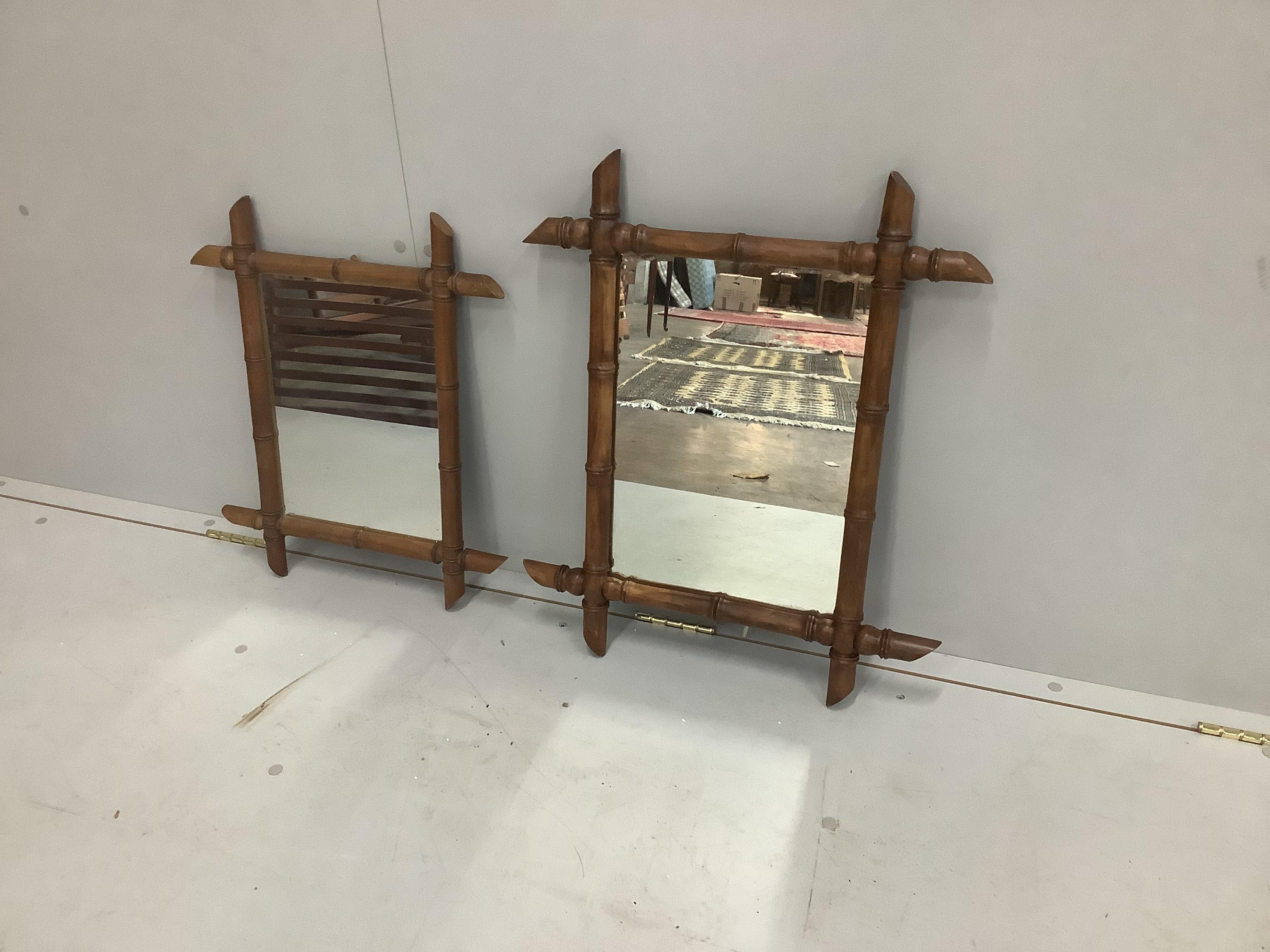 A graduated pair of bamboo moulded wall mirrors, largest 62 x 51cm